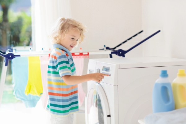 kid controlling propane washer