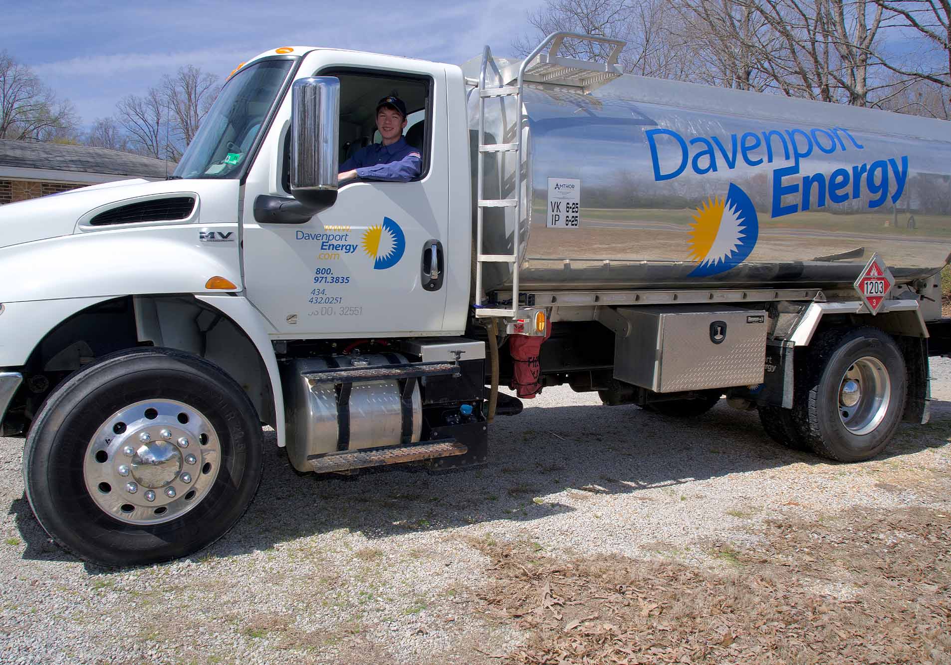 A Davenport Energy heating oil tanker with its driver in the cab