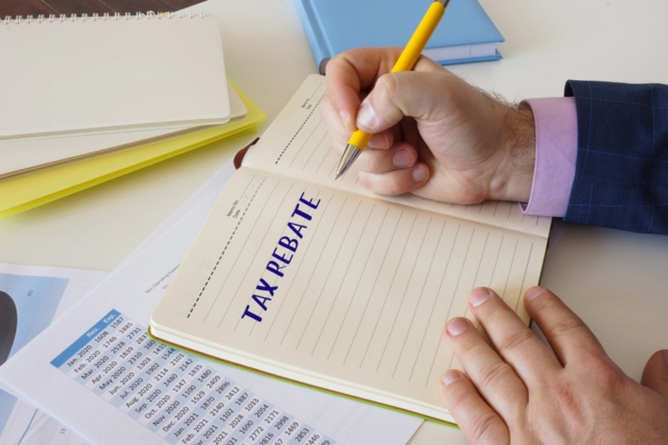 Tax Rebate written on a notebook