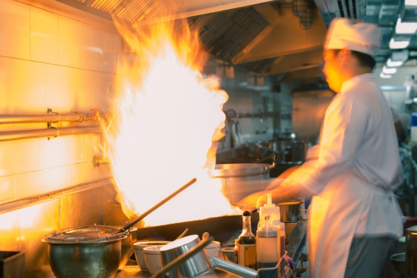 chef cooking using a propane powered stove