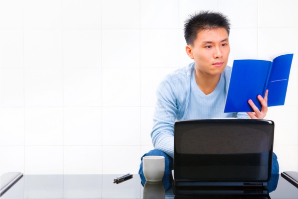 homeowner reading appliance manual