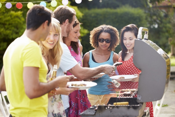 group of friends having backyard barbecue